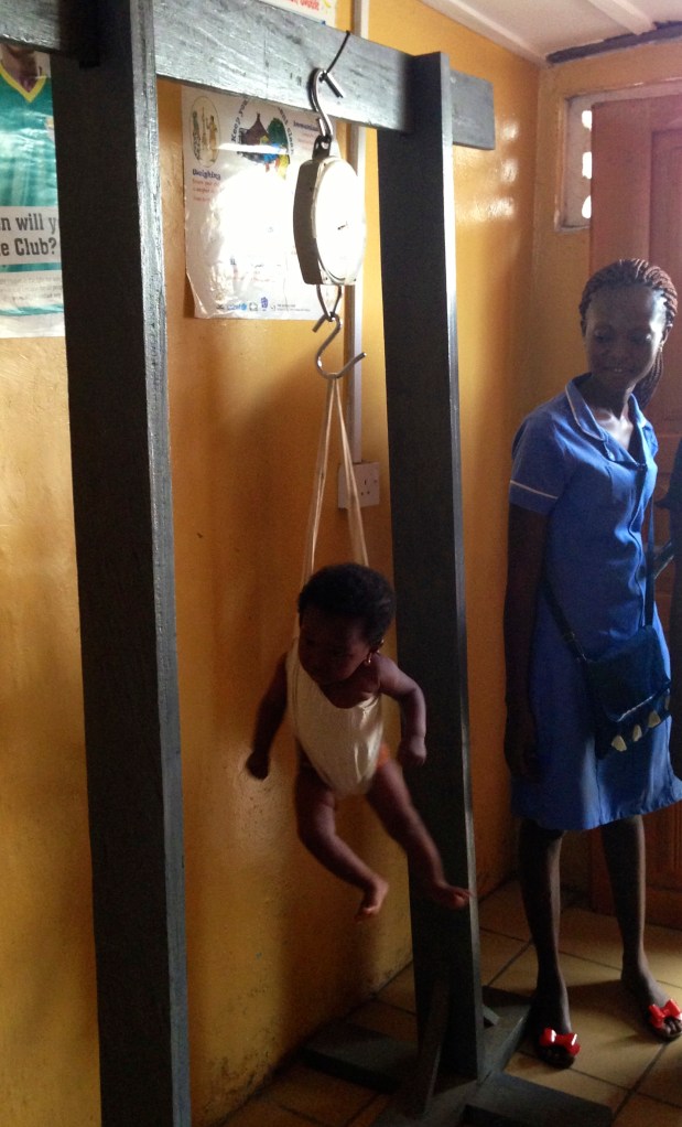 A baby being weighed